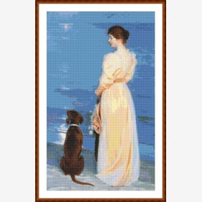 Kvinde med hund p strand